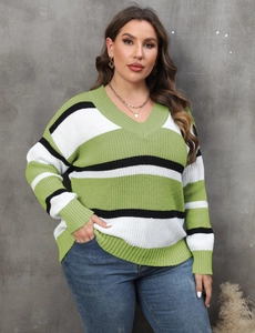 Detailed close-up of V-neckline and tri-color striped knit fabric on oversized sweater