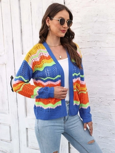 Detailed view of colorful rainbow stripe wave pattern and hollow-out knit texture on cardigan