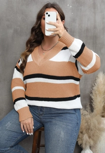 Close-up of V-neck striped color-block knitted sweater in khaki, white, and black