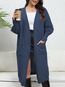 Detail of navy blue knit cardigan with large pockets and stylish ribbed cuffs for women