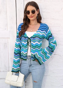 Close-up of rainbow wavy knit cardigan with V-neck tie detail and striped texture