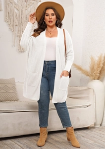 Detail of white knit cardigan with large side pockets and soft ribbed texture weave