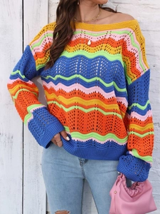 Detail of colorful rainbow wave crochet knit sweater with vibrant hollow-out texture