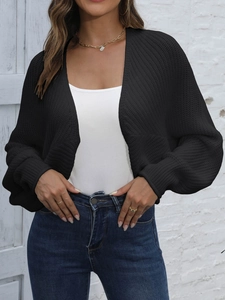 Close-up of black chunky knit cardigan featuring stylish lantern sleeves and drop shoulders