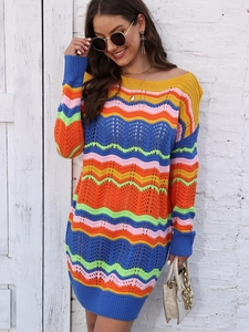 Detail of colorful rainbow wavy knit texture and scalloped stitching on the dress