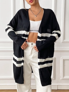 Detail showing the breathable knitted texture and black-and-white striped pattern on the cardigan