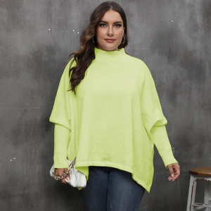 Detail of neon green oversized turtleneck sweater with batwing sleeves and ribbed knit texture