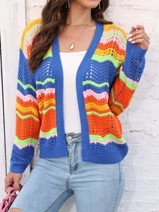 Detail of colorful rainbow striped crochet cardigan with wave pattern and hollow knit design