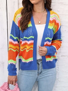 Detailed close-up of rainbow striped knit cardigan with vibrant hollow crochet texture