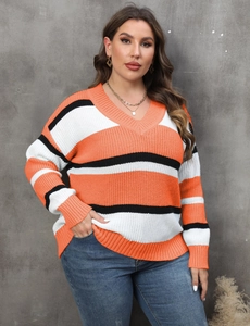 Close-up of ribbed cuffs and vibrant orange color-block pattern on a V-neck knit sweater
