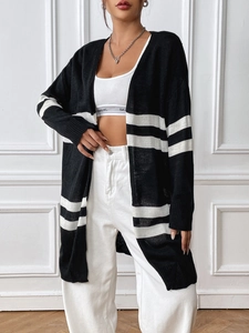 Detail of black and white striped knit cardigan texture and drop shoulder design for women