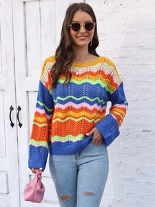 Detailed view of women's rainbow striped crochet knit sweater with wavy wave patterns