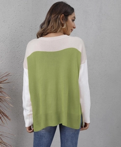 Close-up of the back view showing color-block knit textures and modern side slit detail