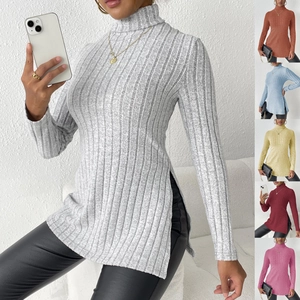 Detail view of side slits and ribbed texture on slim fit women's turtleneck sweaters