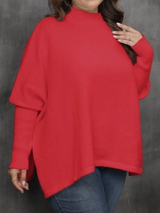 Detail of red oversized turtleneck sweater with batwing sleeves and loose knit texture