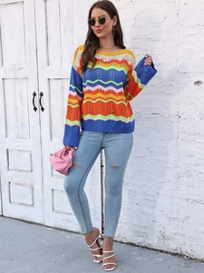 Detail of crochet rainbow striped knit sweater featuring hollow out wavy pattern texture