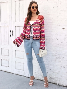 Detail of bohemian knit cardigan with colorful chevron stripes and tie-front closure
