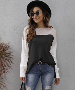Women's color block knit sweater in black, beige and white with a cozy relaxed fit