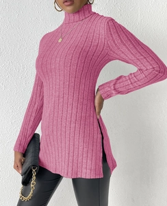 Detail shot of pink ribbed knit turtleneck sweater with high side slits and slim fit