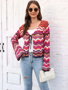 Detail of bohemian crochet cardigan with colorful wavy stripes and flared sleeve design