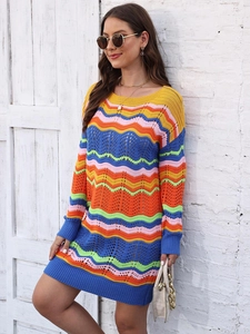 Detailed knit texture of a colorful wave-patterned mini dress with long sleeves