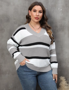 Detailed close-up of V-neck striped plus size knit sweater with ribbed cuffs and hemline