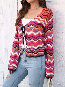 Detail of multi-color wavy crochet knit cardigan with a stylish front tie closure