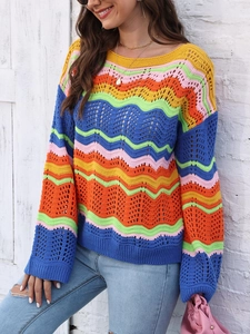 Close-up of vibrant rainbow striped crochet knit texture and intricate wave pattern design