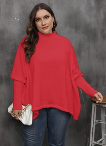 Close-up of bright red mock neck sweater featuring ribbed cuffs and oversized batwing sleeves
