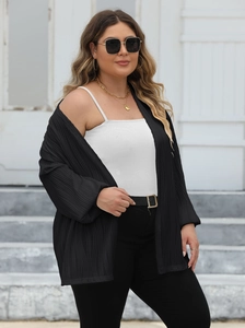 Women's black pleated open front cardigan with lantern sleeves and textured fabric