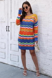 Close-up of colorful rainbow wave crochet knit patterns on long sleeve mini dress