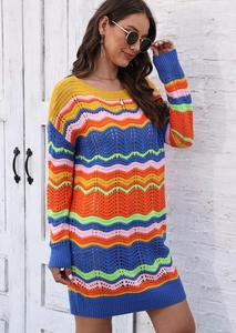 Detailed close-up of rainbow striped crochet knit dress with wavy openwork texture