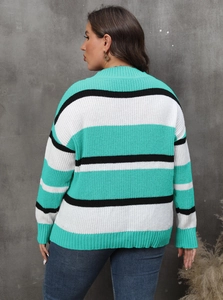 Detail view of the chunky knit texture and striped pattern on the oversized sweater