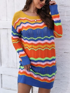Detailed view of the zigzag rainbow knit texture and crochet pattern on a striped dress