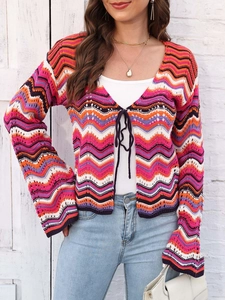 Detail of bohemian crochet cardigan with rainbow wavy stripes and front tie closure