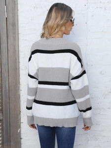 Back view of a loose-fit knit sweater with wide horizontal stripes in grey, white, and black