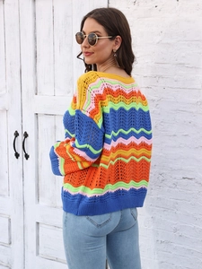 Detailed view of the colorful wave crochet pattern and hollow knit texture on the sweater