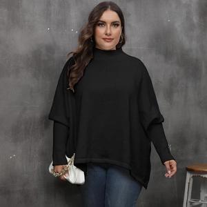 Detail of black turtleneck batwing sweater featuring ribbed cuffs and soft knit texture