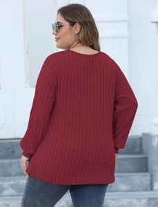 Rear view of burgundy ribbed knit long sleeve sweater showing fabric texture and fit