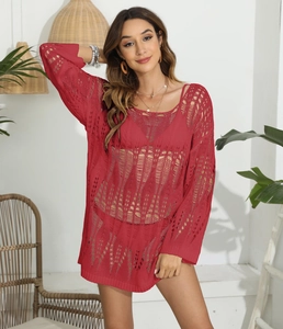 Detailed texture of red crochet knit hollow out long sleeve beach bikini cover-up