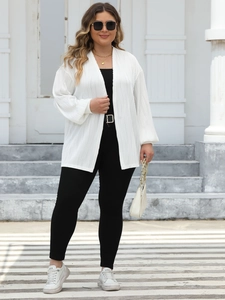 Close-up of white pleated cardigan texture with drop shoulder and lantern sleeve detail