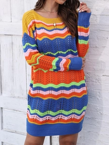 Detail of colorful rainbow wavy knit texture and crochet pattern on striped dress