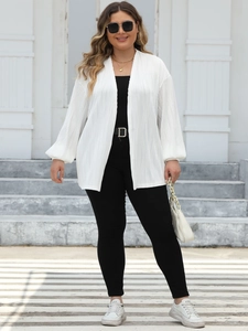Detail of plus size white pleated cardigan with vertical texture and lantern sleeves
