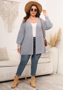 Detail of grey chunky knit cardigan with ribbed texture and loose open-front design