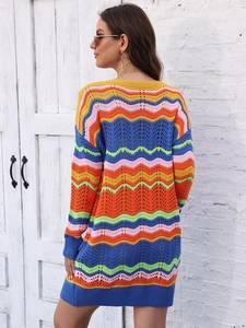 Detail of colorful rainbow crochet knit pattern with wavy stripes on a long sweater