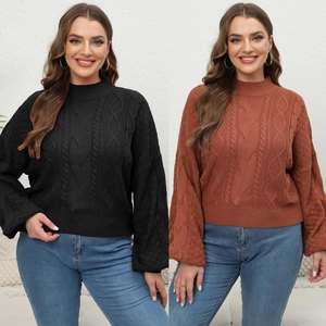 Detailed cable knit pattern on women's crew neck sweater in black and rust red colors