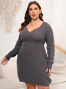 Detail of dark grey knit dress featuring hollow diamond crochet patterns on long sleeves