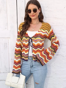 Women's crochet cardigan with rainbow zigzag stripes and flare sleeves for a boho style