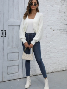 Chic women's white knit cardigan with loose batwing sleeves and ribbed cuffs for fall