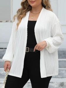 Detail of white pleated fabric texture on open front cardigan with lantern sleeves